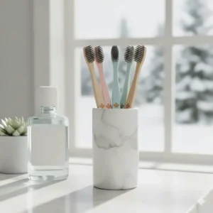 A variety of colorful manual toothbrushes in a bathroom holder, representing the best options for Canadian families.