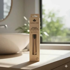 Packaging for a charcoal toothbrush featuring bilingual English and French labeling for the Canadian market.