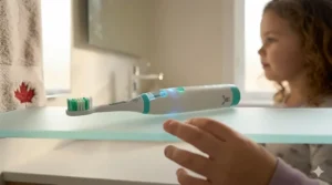 An easy-grip AI toothbrush for kids in "Northern Lights" teal, perfect for small hands and effective plaque removal.