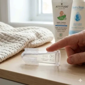 Close-up illustration of a medical-grade silicone finger toothbrush for babies showing non-toxic, Health Canada compliant materials.