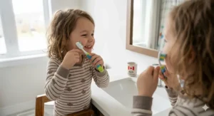 Step-by-step illustration of the circular brushing motion using a soft-bristle toothbrush for 4 year old kids.
